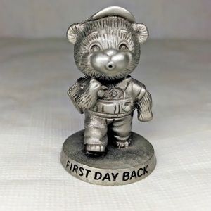 This is an Avon vintage Benjamin J Barrington “first day back“ figurine.